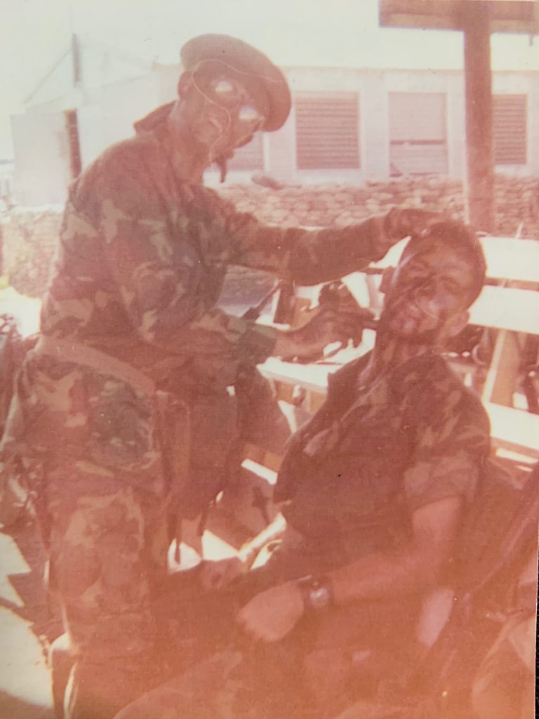 Pictured above are Mr. Mike (seated) and one of his LRRP team members preparing for an operation. One thing discussed in our interview were the necessary preparations for surviving in the field. Some of the more surprising habits were burying rucks and clothes in the dirt 48 hours prior to departure and consuming only VC rations in this same two-day period.